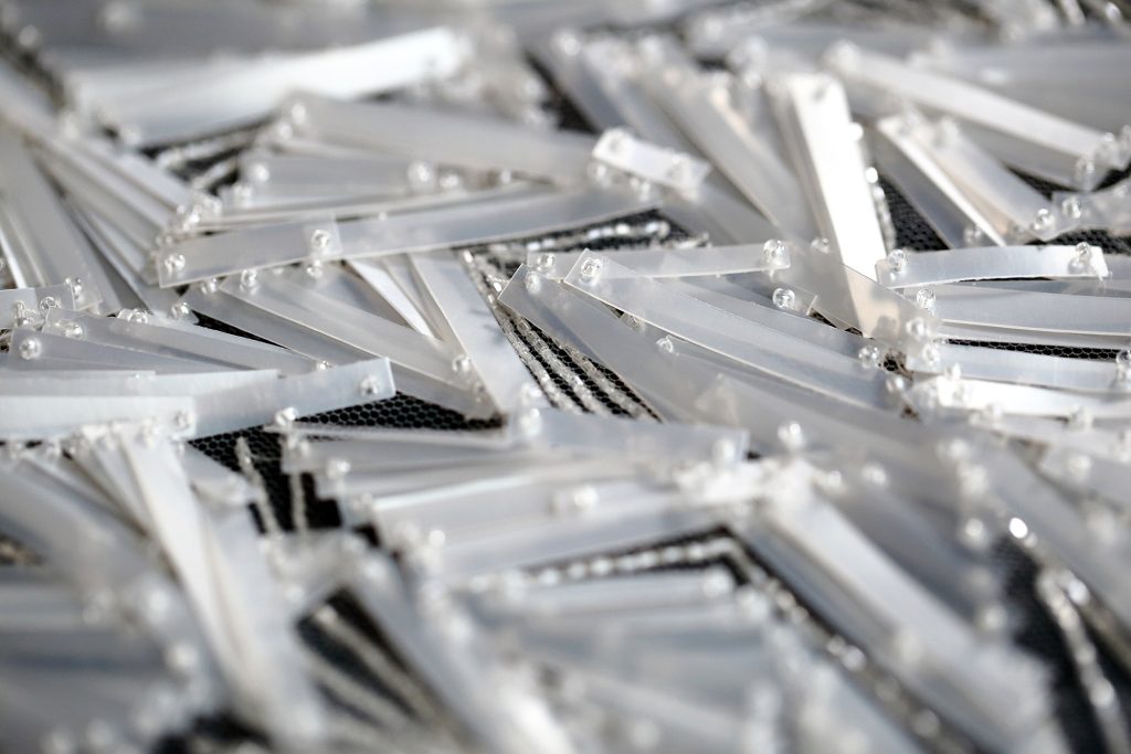 An.  unconventional bridal hand embroidery with long sequins and bead embellishments. 